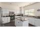 Modern kitchen with granite countertops and white cabinets at 1325 E Sheena Dr, Phoenix, AZ 85022