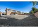 Two story home with large backyard and gravel landscaping at 15611 W Cameron Dr, Surprise, AZ 85379