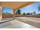 Large backyard with covered patio and gravel landscaping at 15611 W Cameron Dr, Surprise, AZ 85379