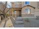 Front entrance with stone accents and a walkway leading to the door at 15611 W Cameron Dr, Surprise, AZ 85379