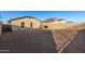 House backside view with backyard and fence at 165 W Taylor Ave, Coolidge, AZ 85128