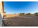 Large gravel backyard with block wall and fence at 165 W Taylor Ave, Coolidge, AZ 85128