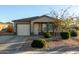 One-story home with a landscaped front yard and driveway at 165 W Taylor Ave, Coolidge, AZ 85128