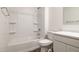 Bathroom with shower/tub combo and white cabinets at 18350 W Smoketree Dr, Wittmann, AZ 85361