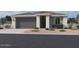 One-story home with gray garage door and light-colored stone exterior at 22835 E Lords Way, Queen Creek, AZ 85142