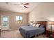 Main bedroom with private access to backyard and ceiling fan at 28109 N Raelynn Ln, Queen Creek, AZ 85144