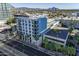 Aerial view of modern building, pool, and urban setting at 3131 N Central Ave # 5017, Phoenix, AZ 85012