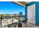 Private balcony with city views and wicker chairs at 3131 N Central Ave # 5017, Phoenix, AZ 85012