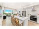 Modern kitchen with island, stainless steel appliances, and white cabinets at 3131 N Central Ave # 5017, Phoenix, AZ 85012