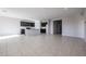 Kitchen features an island and dark brown cabinets at 35645 W Mallorca Ave, Maricopa, AZ 85138