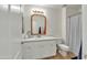 Bathroom with white cabinets and a shower/tub combo at 3769 E Kerry Ln, Phoenix, AZ 85050