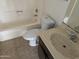 Clean bathroom with tub, toilet, and vanity at 4766 W Rose Ln, Glendale, AZ 85301