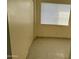 Bedroom with tile floors, window coverings, and mirrored closet doors at 4766 W Rose Ln, Glendale, AZ 85301