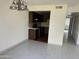 Bright dining area with tile floors and kitchen view at 4766 W Rose Ln, Glendale, AZ 85301