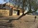Tan stucco condo with tile roof and wooden fence at 4766 W Rose Ln, Glendale, AZ 85301