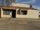 Tan stucco condo with tile roof and a walkway to the entrance at 4766 W Rose Ln, Glendale, AZ 85301