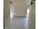 Spacious living room with tile floors and access to patio at 4766 W Rose Ln, Glendale, AZ 85301