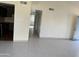Living room with tile floors and hallway to kitchen at 4766 W Rose Ln, Glendale, AZ 85301