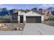 One-story home with a two-car garage and desert landscaping at 492 W Freedom St, Florence, AZ 85132