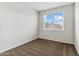 Bright bedroom with brown carpet and large window at 504 W Freedom St, Florence, AZ 85132