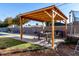 Wooden pergola with seating area for outdoor dining at 6517 W Georgia Ave, Glendale, AZ 85301