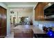 Kitchen with island, dining area view, and ample storage at 6934 E Bramble Berry Ln, Scottsdale, AZ 85266