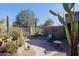 Small patio with seating area and desert plants at 6934 E Bramble Berry Ln, Scottsdale, AZ 85266