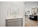 Clean and modern half-bath with gray vanity and white countertop at 7504 S 75Th Dr, Laveen, AZ 85339