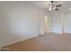 Spacious bedroom with ceiling fan and neutral carpeting at 831 W Sycamore Ct, Litchfield Park, AZ 85340