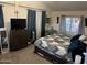 Spacious bedroom with king-size bed and dresser at 10120 E Mclellan Rd, Mesa, AZ 85207