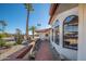 Side view of single story home with walkway, desert landscaping, and arched windows at 12515 W Eveningside Dr, Sun City West, AZ 85375