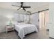 Bright bedroom with white bedding, nightstands, and a barn door at 1322 E Colter St, Phoenix, AZ 85014