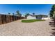 Spacious backyard with grassy area and gravel at 14236 N 35Th St, Phoenix, AZ 85032