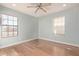 Bright bedroom with wood floors, ceiling fan, and ample closet space at 1920 E Palomino Dr, Tempe, AZ 85284