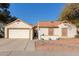 Single-story home with tile roof, attached garage, and landscaped front yard at 1920 E Palomino Dr, Tempe, AZ 85284