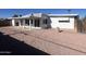 Large backyard with gravel and a patio at 2045 E Birchwood Ave, Mesa, AZ 85204