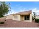 Spacious backyard with gravel, neutral colored walls and a view of neighboring house at 22409 N Los Gatos Dr, Sun City West, AZ 85375