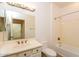 Clean bathroom with a tub, toilet and vanity at 22409 N Los Gatos Dr, Sun City West, AZ 85375