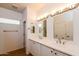 Double vanity bathroom with light beige tile floors at 22409 N Los Gatos Dr, Sun City West, AZ 85375