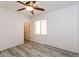 Bright bedroom with wood-look floors and ceiling fan at 22409 N Los Gatos Dr, Sun City West, AZ 85375