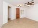 Light and airy entryway with tile floors and wood door at 22409 N Los Gatos Dr, Sun City West, AZ 85375