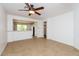 Bright living room with tile floors and view into kitchen at 22409 N Los Gatos Dr, Sun City West, AZ 85375