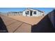 Large backyard with new home and block wall at 35595 W Mallorca Ave, Maricopa, AZ 85138