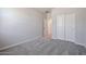 Spacious bedroom with carpet flooring and a large closet at 35595 W Mallorca Ave, Maricopa, AZ 85138