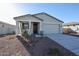 Newly constructed home with two-car garage and desert landscaping at 35595 W Mallorca Ave, Maricopa, AZ 85138