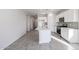 Modern kitchen with island and stainless steel appliances at 35595 W Mallorca Ave, Maricopa, AZ 85138