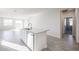 Modern kitchen with island and stainless steel appliances at 35595 W Mallorca Ave, Maricopa, AZ 85138