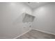Laundry room with built-in shelving and hookups at 35595 W Mallorca Ave, Maricopa, AZ 85138