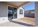 Covered patio with sliding glass door access to backyard at 35595 W Mallorca Ave, Maricopa, AZ 85138