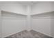 Large walk-in closet with double hanging rods at 35595 W Mallorca Ave, Maricopa, AZ 85138